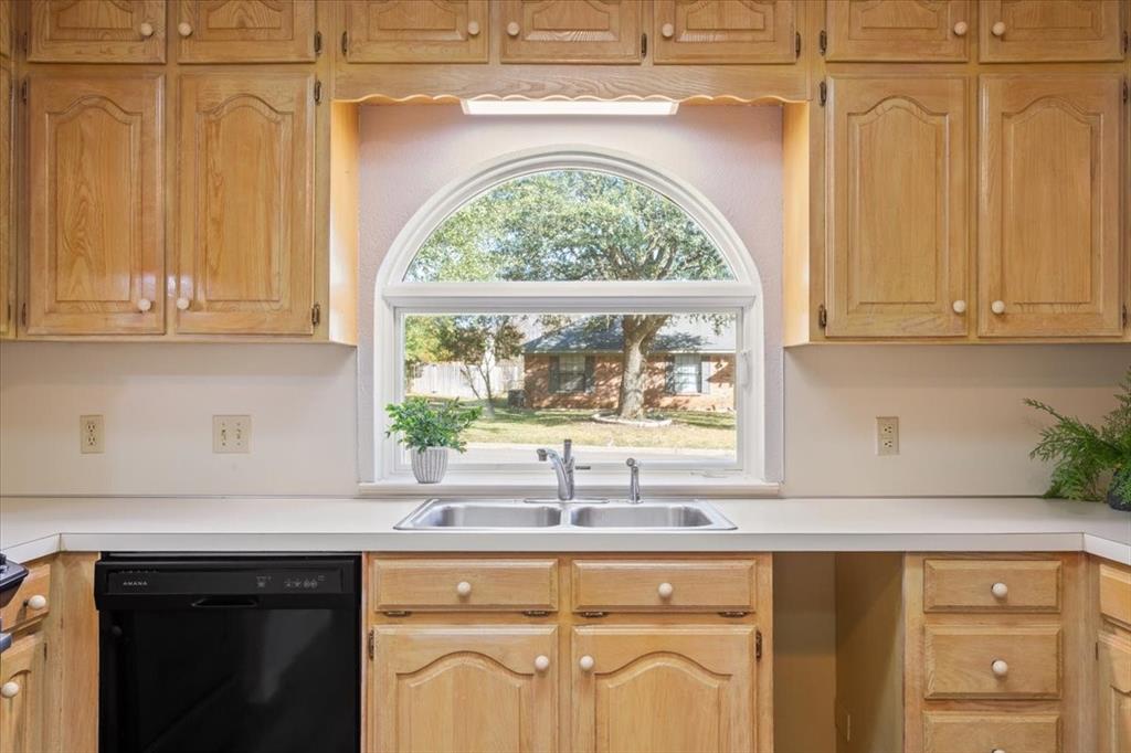 327 East Chapman Road Hewitt, TX 76643 - Photo 15 of 30 a kitchen with a sink a window and cabinets