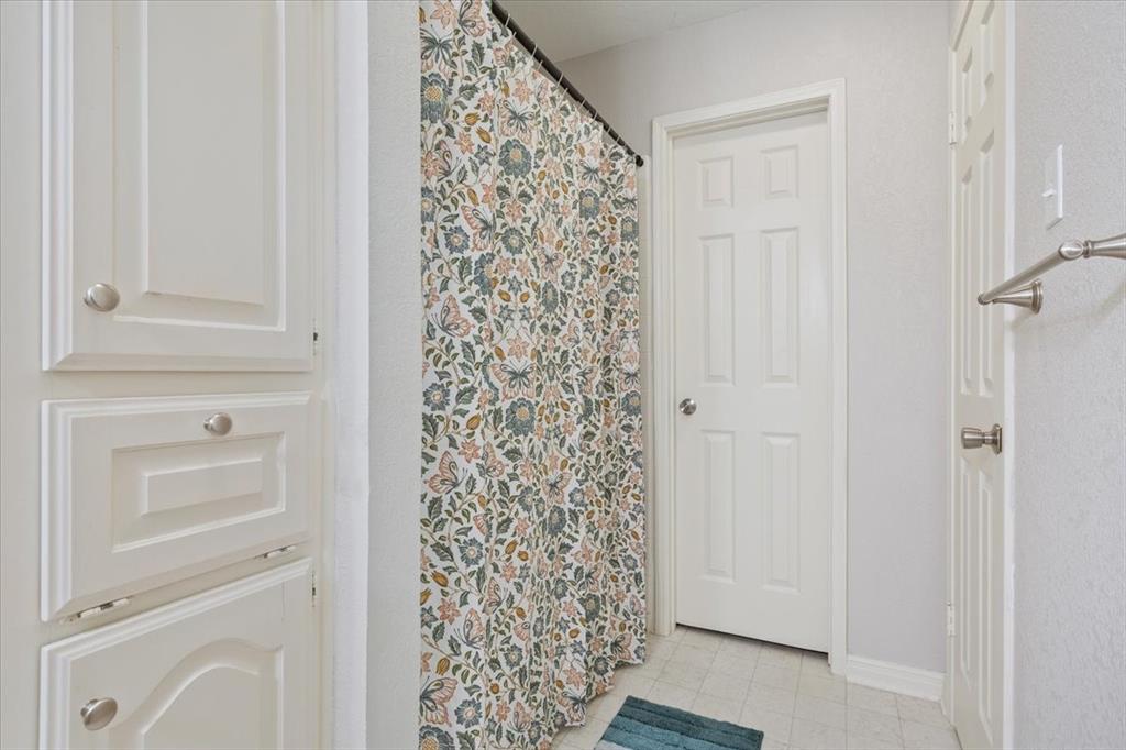 327 East Chapman Road Hewitt, TX 76643 - Photo 16 of 28 a bathroom with a shower curtain and a sink