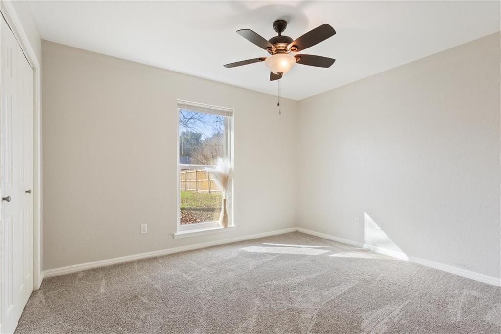 327 East Chapman Road Hewitt, TX 76643 - Photo 17 of 28 an empty room with a window and a fan
