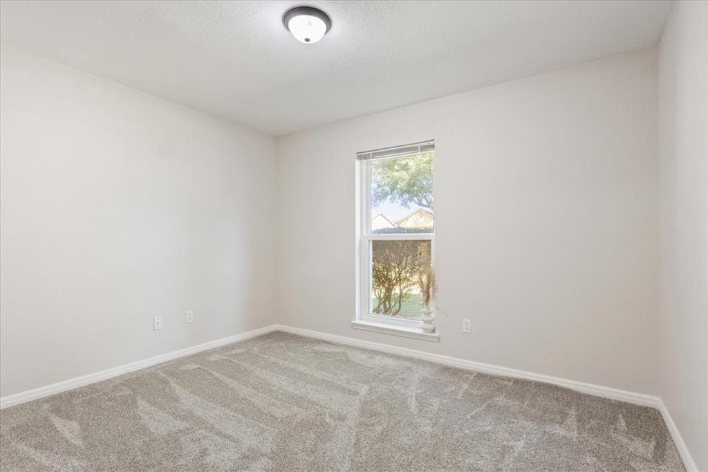 327 East Chapman Road Hewitt, TX 76643 - Photo 23 of 30 an empty room with a window