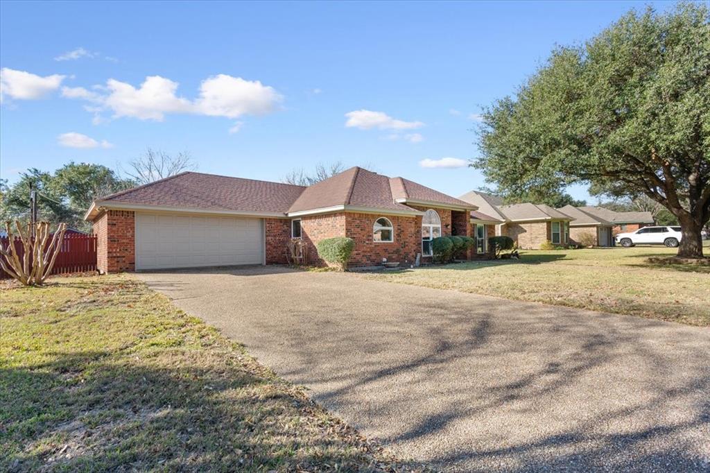 327 East Chapman Road Hewitt, TX 76643 - Photo 4 of 30 a front view of a house with a yard
