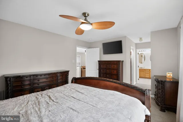 a bedroom with a bed and a fireplace