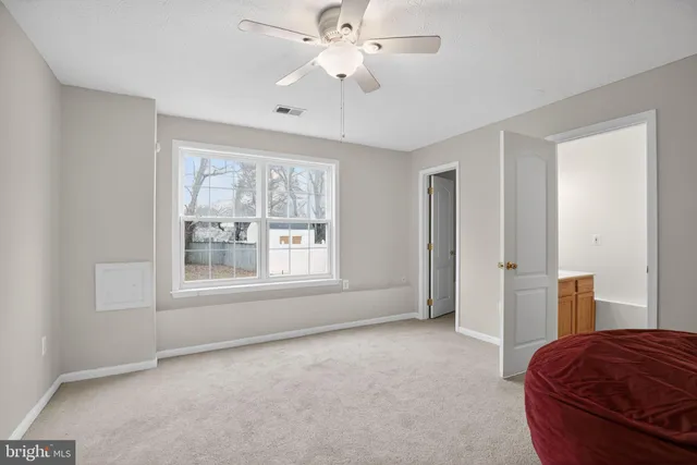 a bedroom with furniture and window