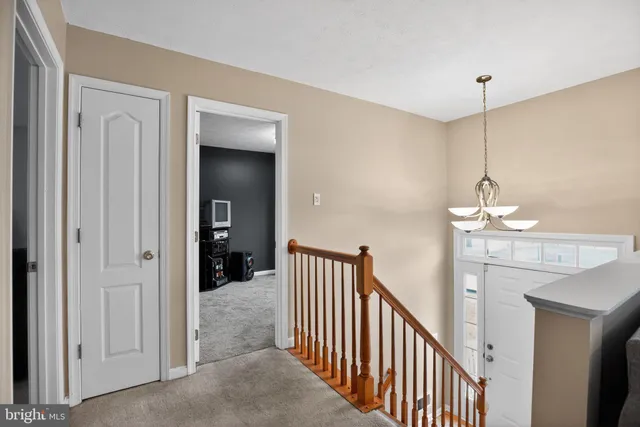 a view of a hallway view with staircase