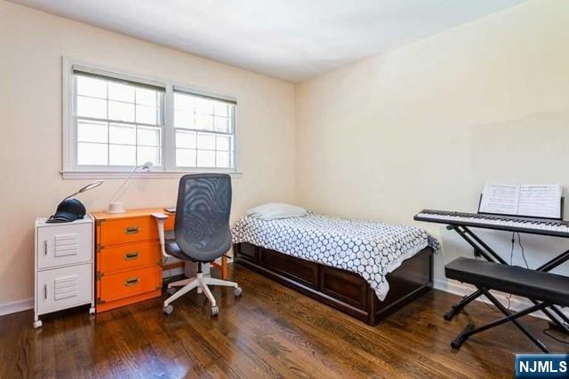 437 Summit Street Englewood Cliffs, NJ 07632 - Photo 15 of 25 a bedroom with a bed and wooden floor