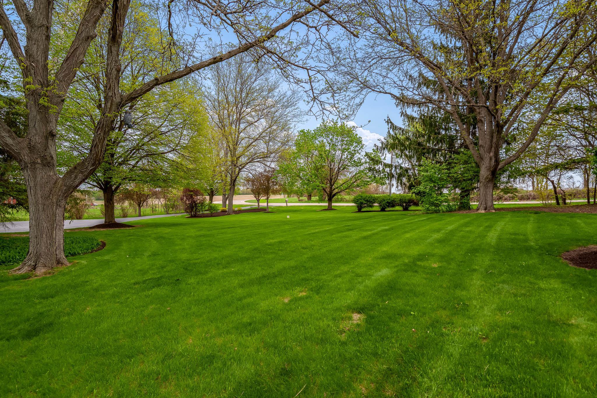 10562 Town Hall Road Belvidere, IL 61008 - Photo 58 of 72 a view of grassy field with benches and trees all around