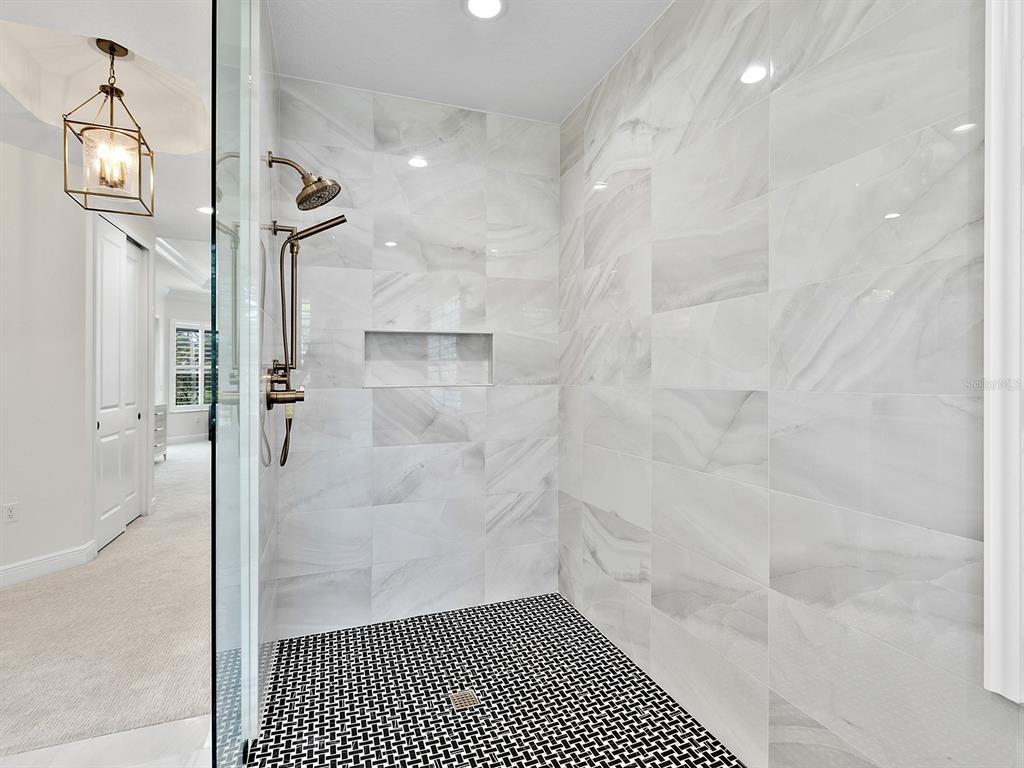 7431 Greystone Street Lakewood Ranch, FL 34202 - Photo 41 of 85 a bathroom with a shower