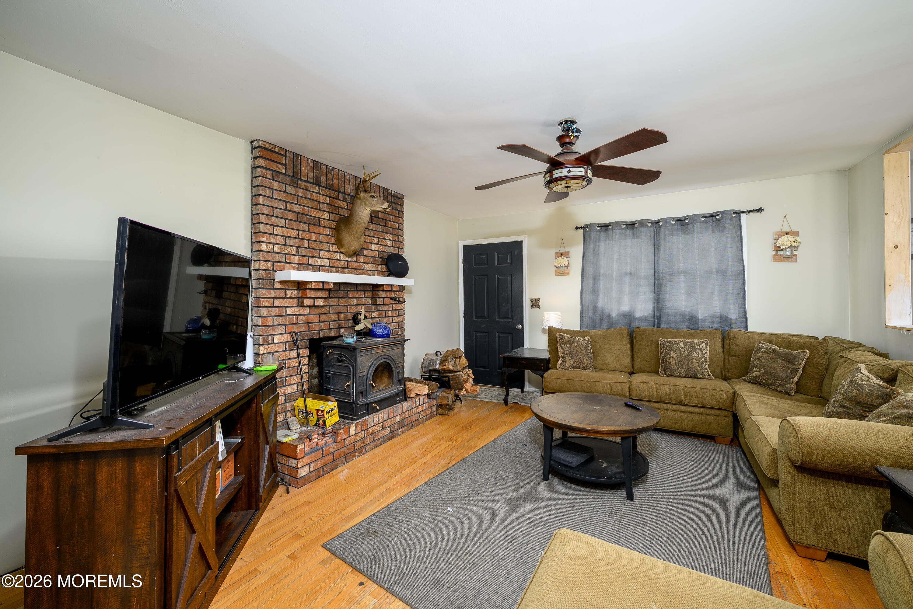 2 Lawrence Avenue Howell, NJ 07731 - Photo 3 of 10 a living room with furniture and a flat screen tv