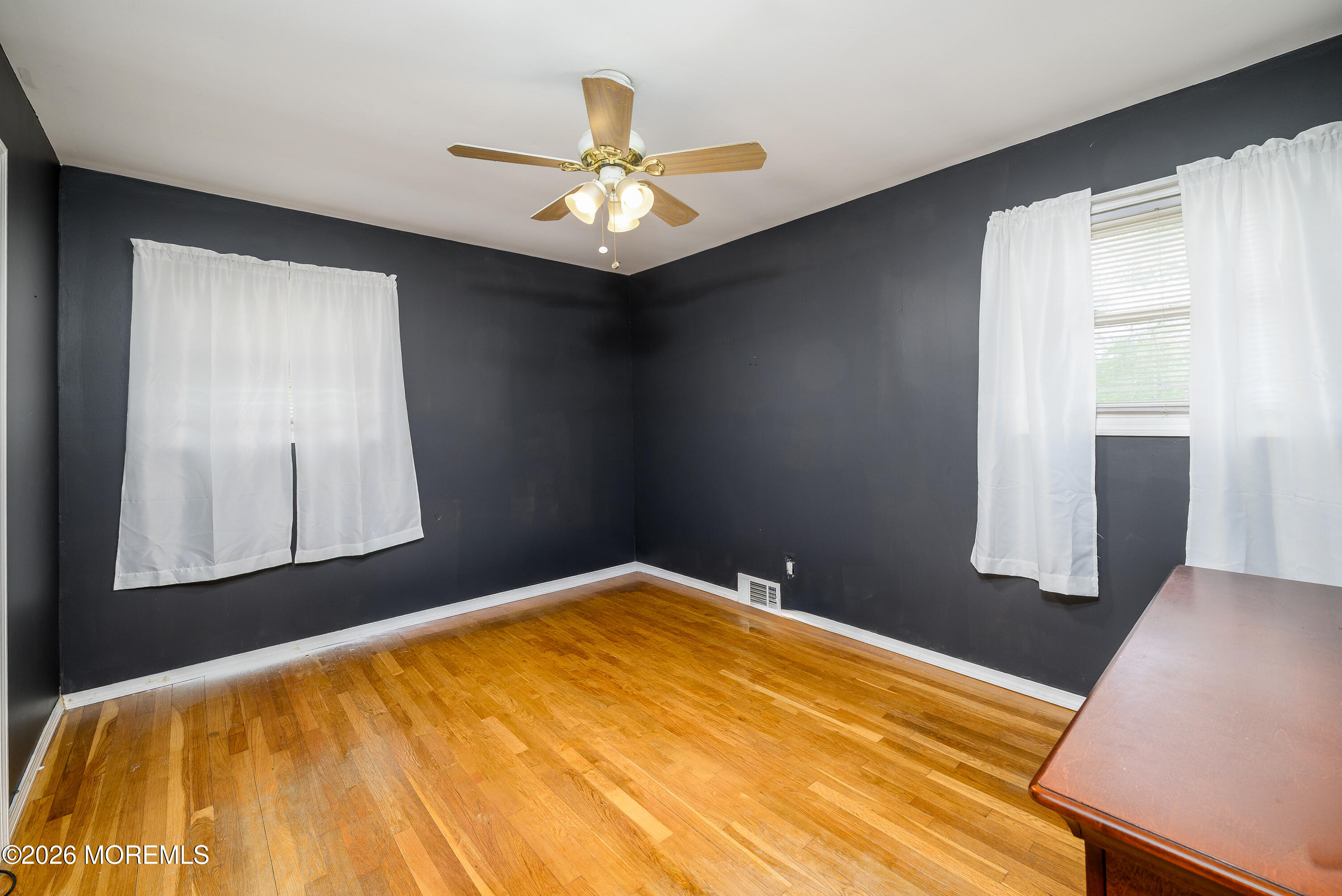 2 Lawrence Avenue Howell, NJ 07731 - Photo 5 of 10 a bedroom with a bed and a chandelier