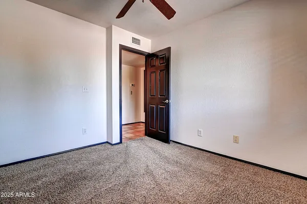 a bathroom with a granite countertop toilet a sink and bathtub