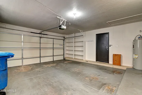 a view of a livingroom with a ceiling fan and window