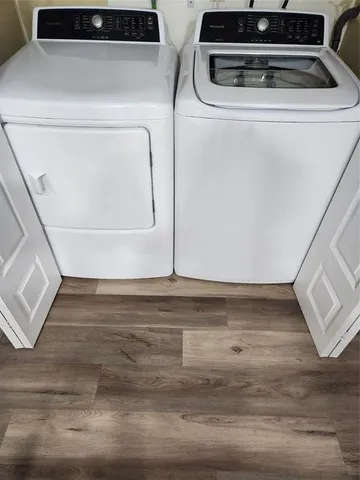 a front view of a house with white walls