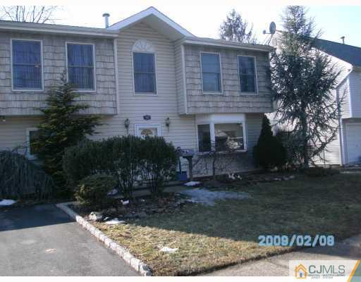 24 Stony Road Edison, NJ 08817 - Photo 1 of 7 a front view of a house with a yard
