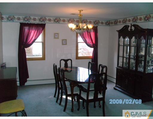 24 Stony Road Edison, NJ 08817 - Photo 3 of 7 a view of a dining room with furniture and window
