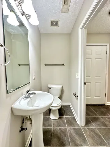 a bathroom with a sink and a toilet