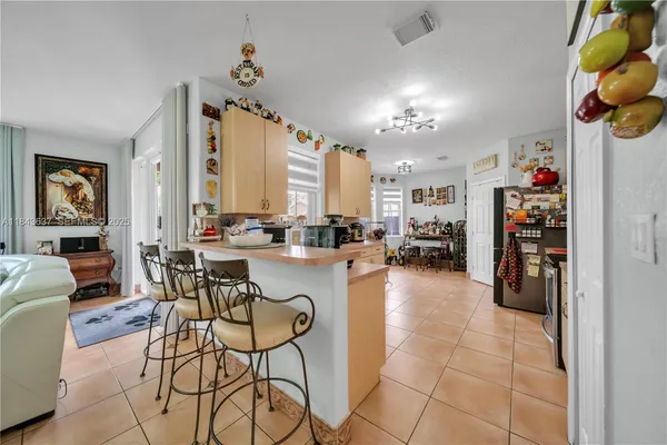 a kitchen with a sink a stove and cabinets