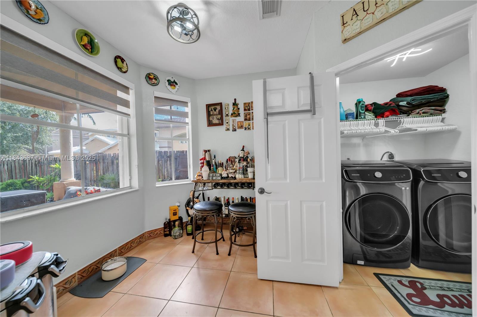 12355 Southwest 124th Terrace Miami, FL 33186 - Photo 22 of 38 a view of a storage and utility room with washer and dryer