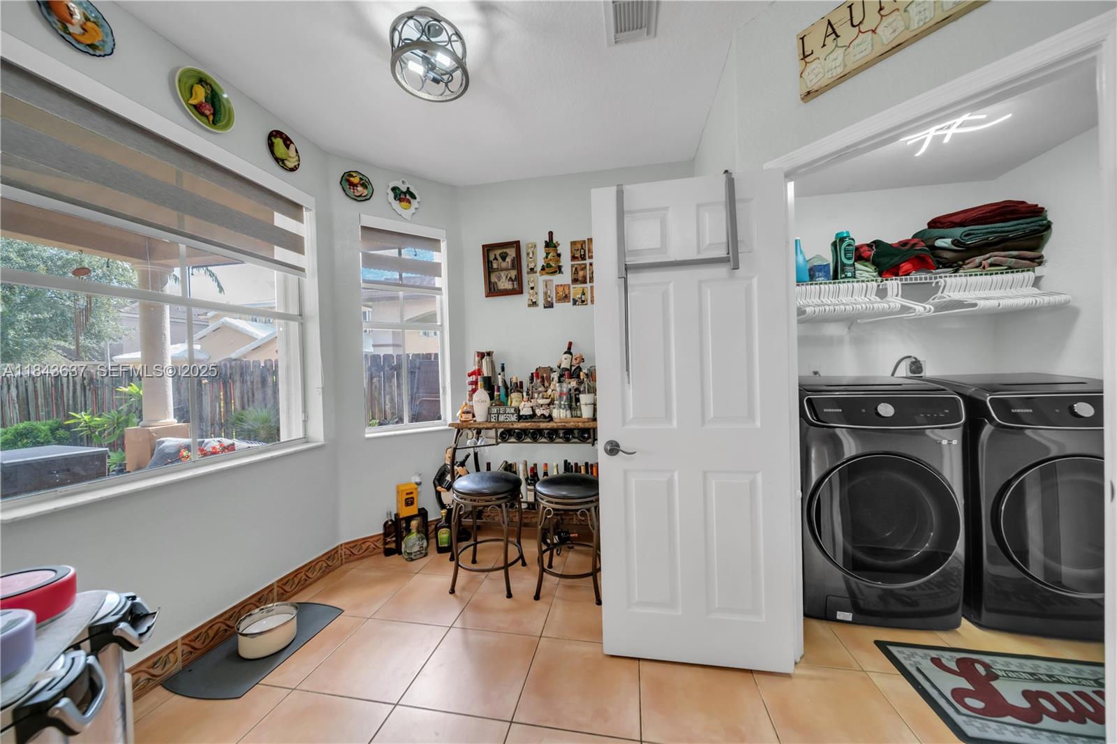 12355 Southwest 124th Terrace Miami, FL 33186 - Photo 22 of 38 a view of a storage and utility room with washer and dryer