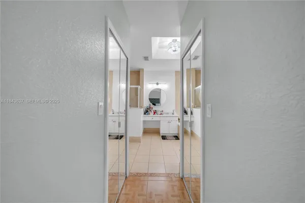 a room with a baby crib furniture and a window