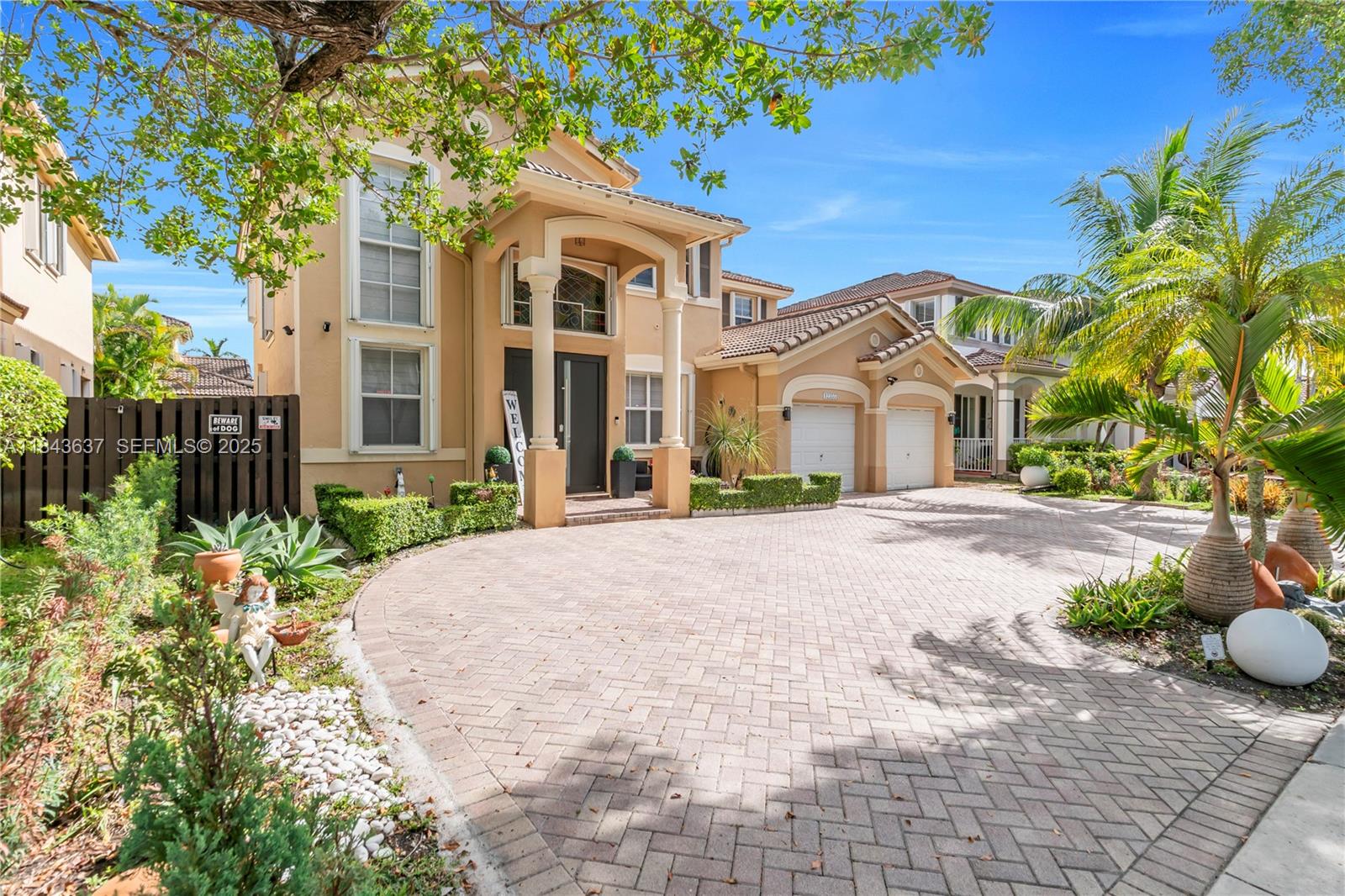 12355 Southwest 124th Terrace Miami, FL 33186 - Photo 3 of 38 a front view of a house with garden