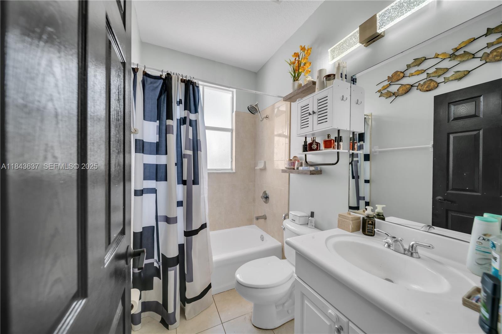 12355 Southwest 124th Terrace Miami, FL 33186 - Photo 33 of 38 a bathroom with a sink toilet and shower