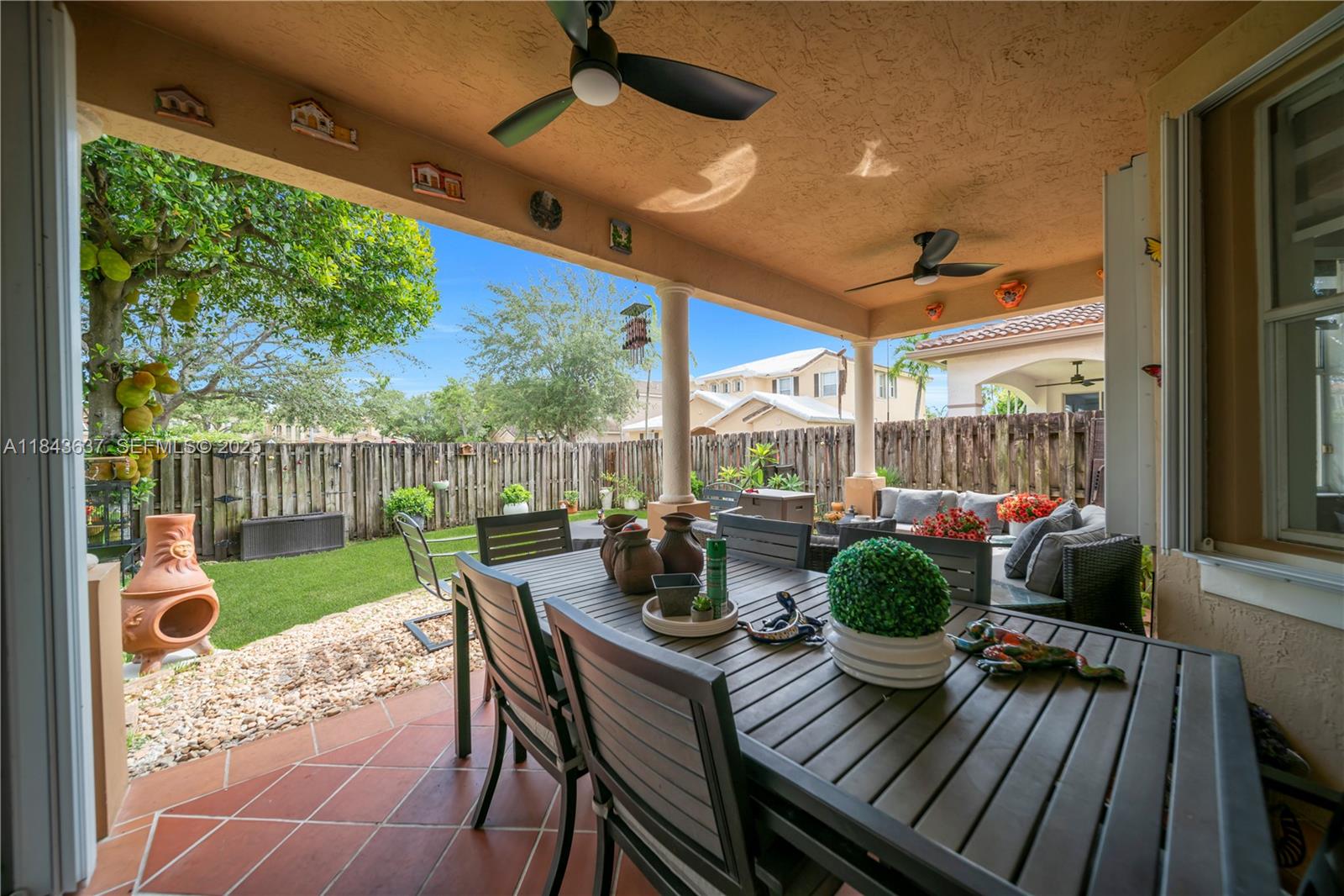 12355 Southwest 124th Terrace Miami, FL 33186 - Photo 37 of 38 a view of a porch with furniture and wooden floor