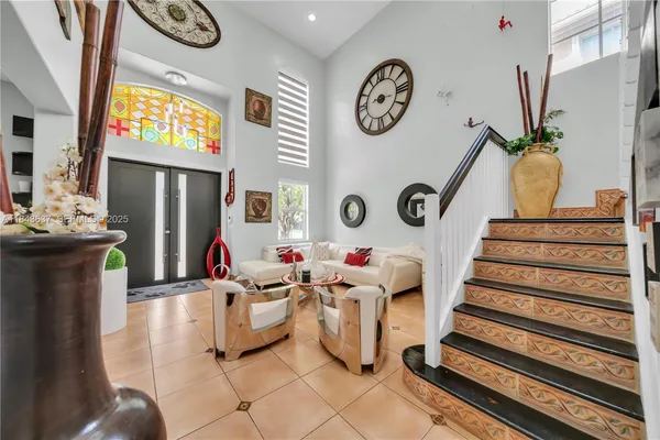 a view of a room with furniture and wooden floor