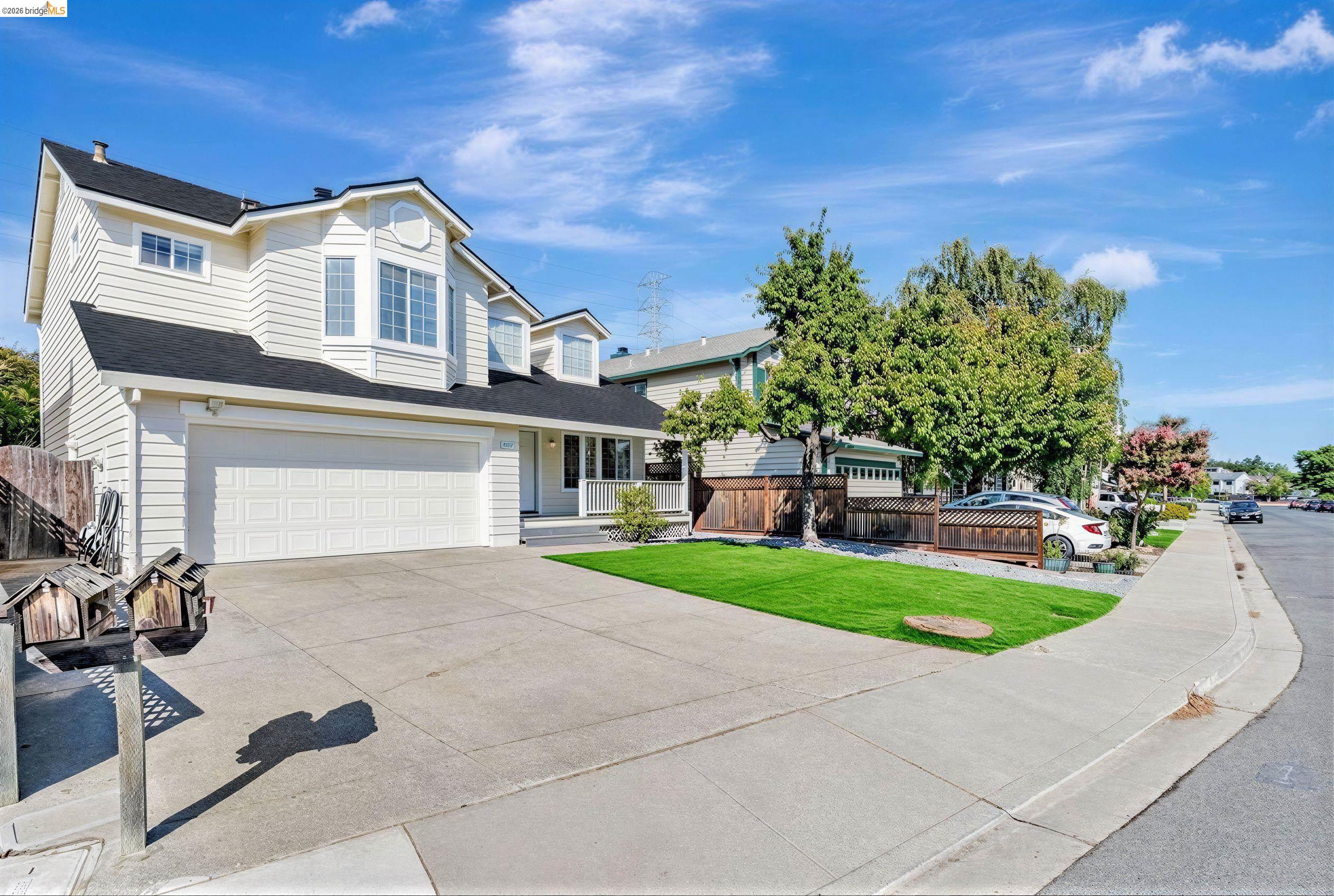 5052 Perry Way Antioch, CA 94531 - Photo 2 of 51 a front view of a house with a yard and garage