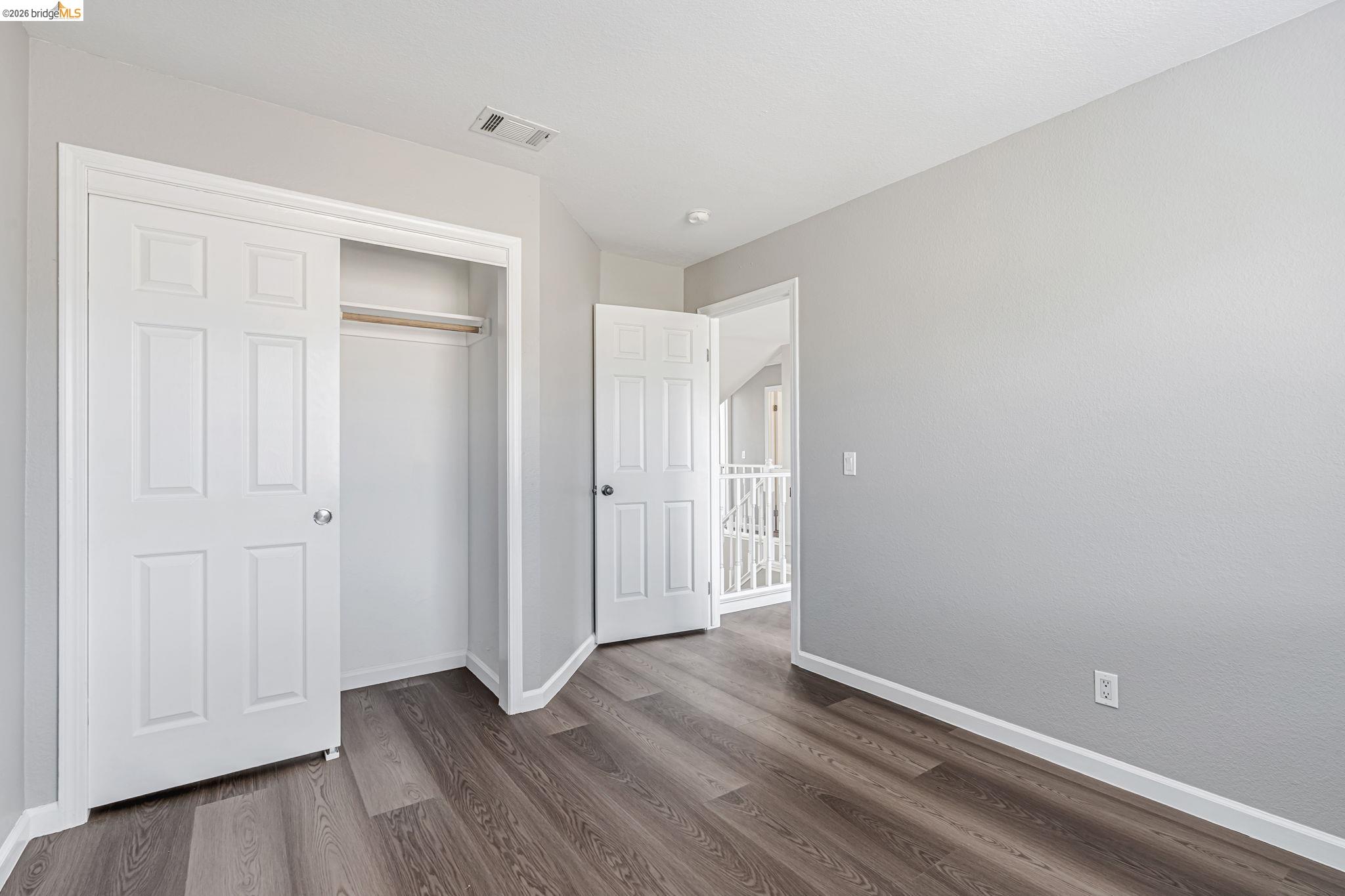 5052 Perry Way Antioch, CA 94531 - Photo 27 of 51 a view of empty room with wooden floor