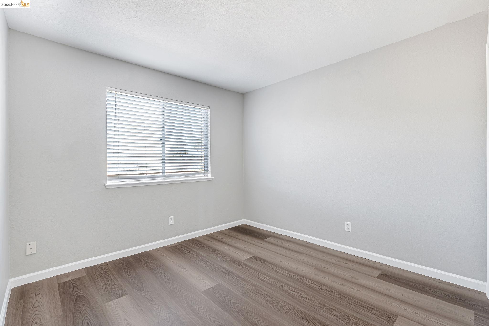 5052 Perry Way Antioch, CA 94531 - Photo 31 of 51 wooden floor in an empty room with a window