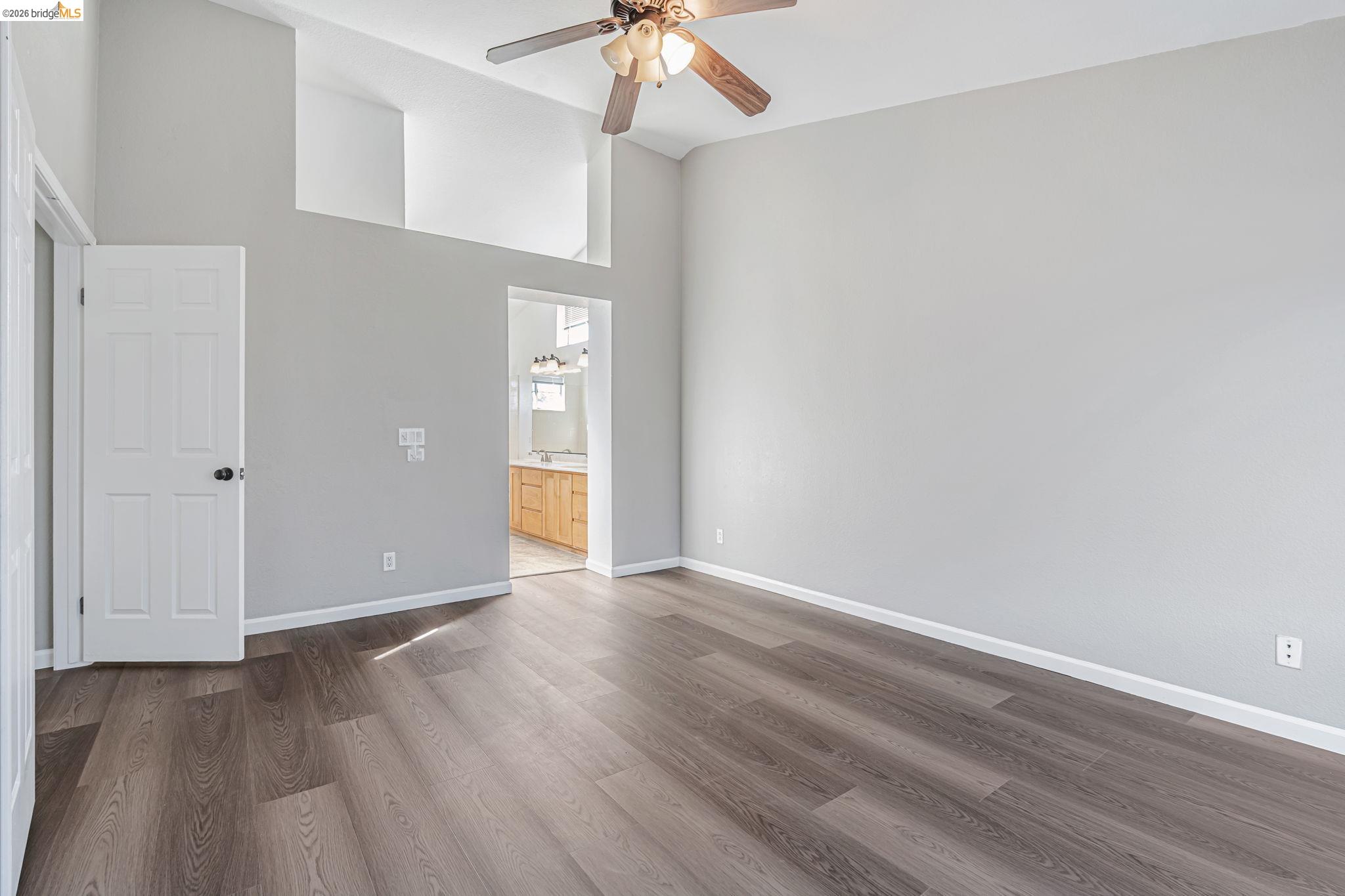 5052 Perry Way Antioch, CA 94531 - Photo 36 of 51 a view of an empty room with window and wooden floor