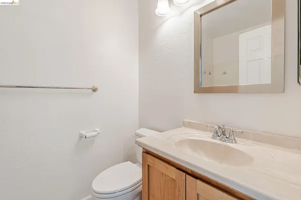 a bathroom with a sink toilet and vanity