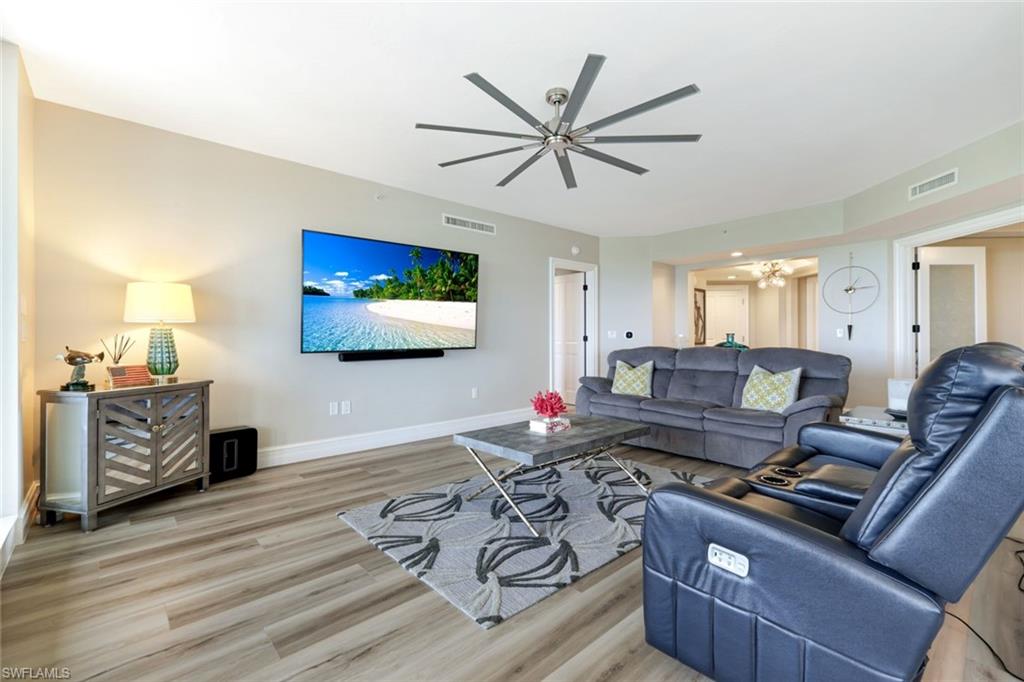 1060 Borghese Lane, Unit 902 Naples, FL 34114 - Photo 11 of 24 a living room with furniture and a flat screen tv