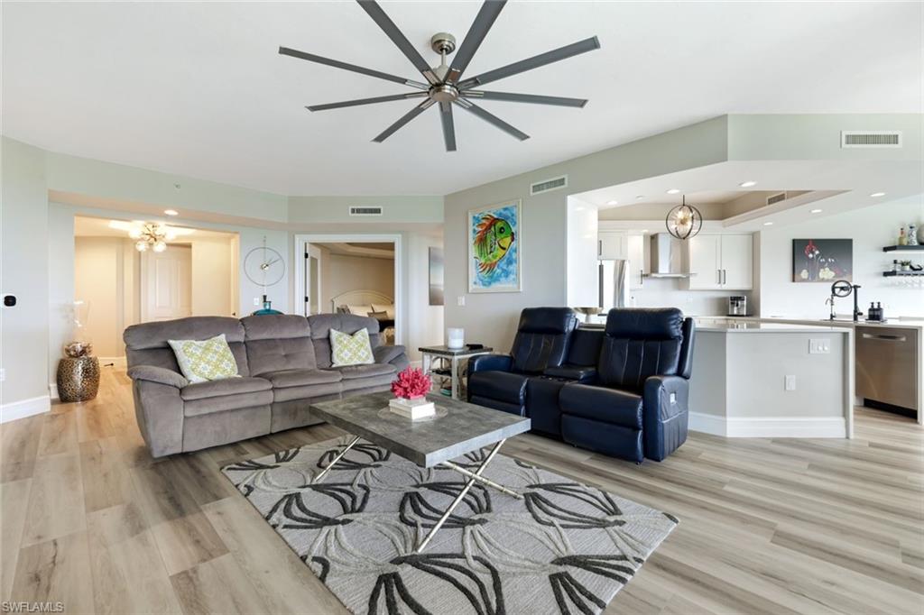1060 Borghese Lane, Unit 902 Naples, FL 34114 - Photo 12 of 24 a living room with furniture and kitchen view