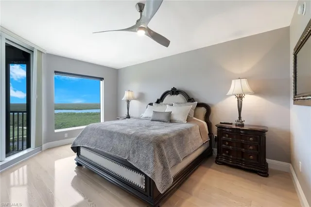 a bed room with a bed and a night stand