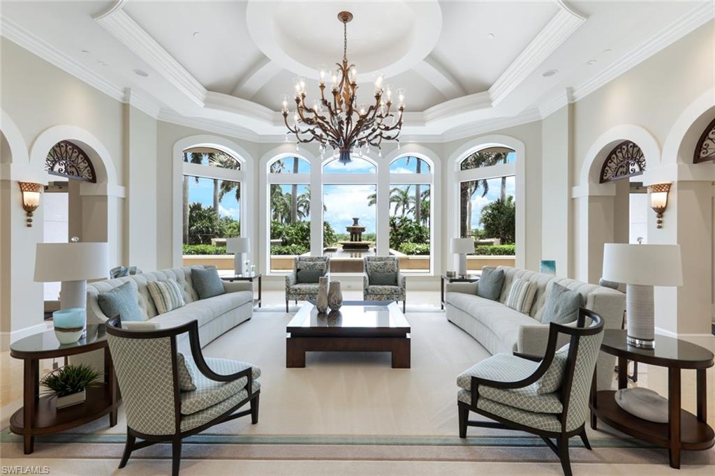 1060 Borghese Lane, Unit 902 Naples, FL 34114 - Photo 24 of 24 a living room with furniture and a large window