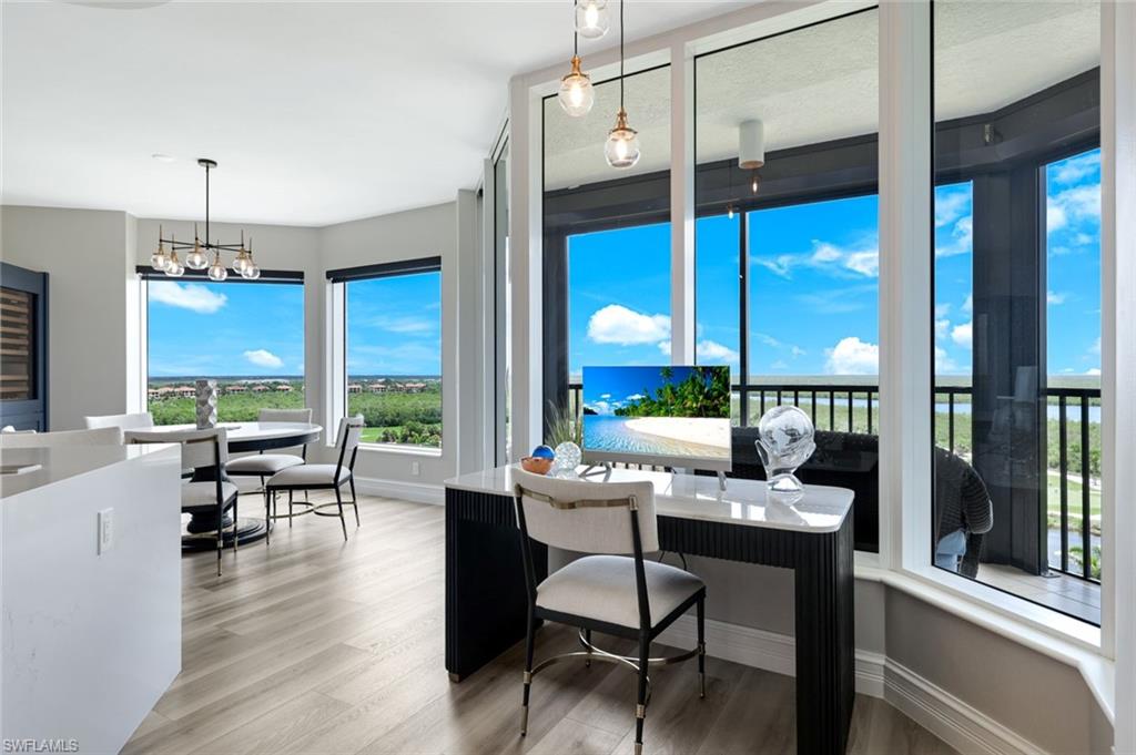 1060 Borghese Lane, Unit 902 Naples, FL 34114 - Photo 9 of 24 a room with furniture and large windows