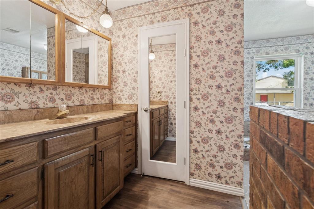 2300 Union Hill Road Sanger, TX 76266 - Photo 18 of 34 a bathroom with a double vanity sink and a mirror