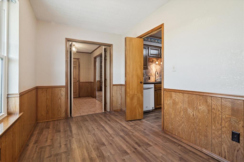 2300 Union Hill Road Sanger, TX 76266 - Photo 20 of 34 a view of an empty room with wooden floor and a window