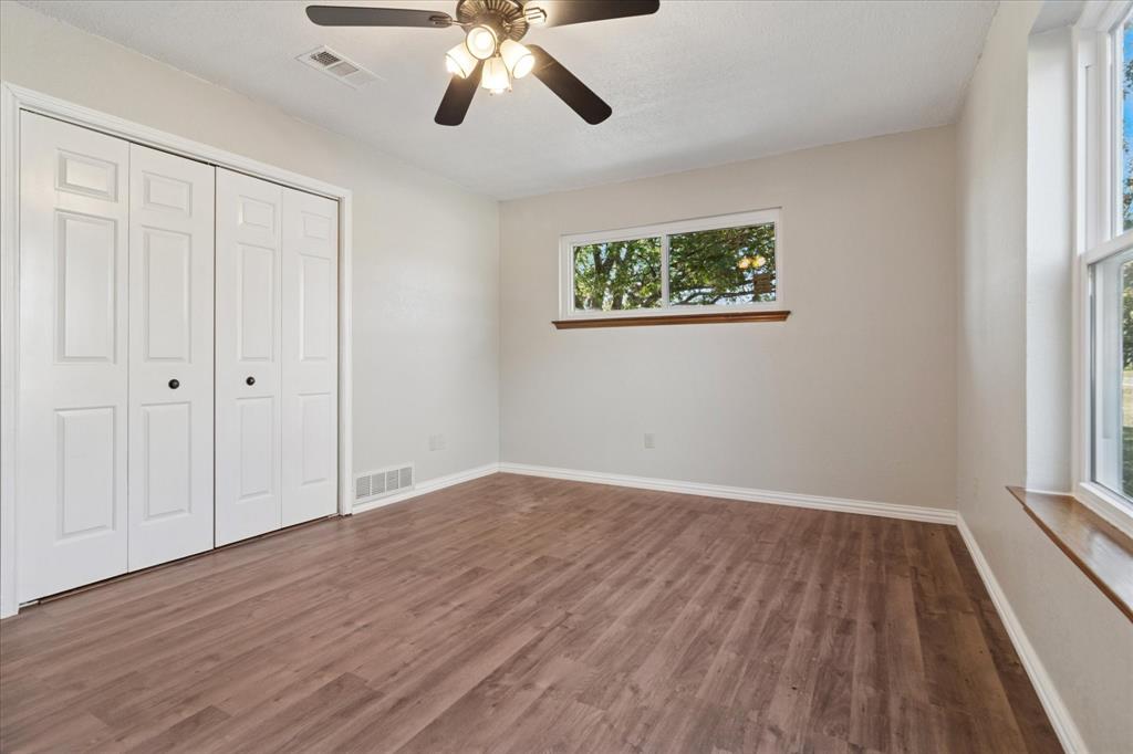 2300 Union Hill Road Sanger, TX 76266 - Photo 24 of 34 wooden floor in an empty room with a window