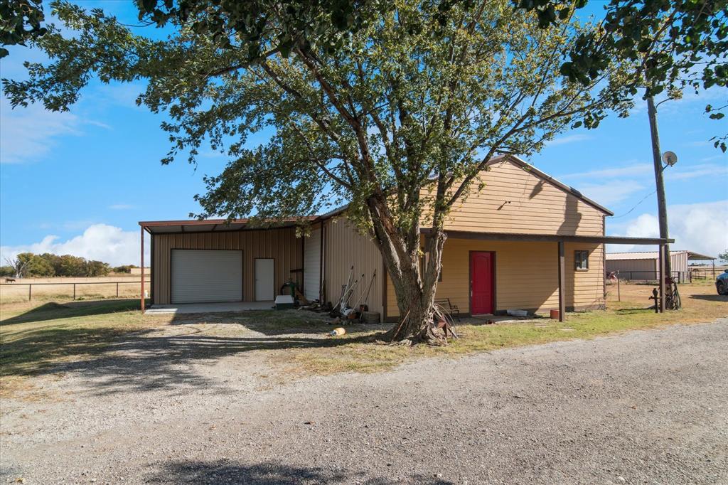 2300 Union Hill Road Sanger, TX 76266 - Photo 26 of 34 a view of a house with a yard and large tree