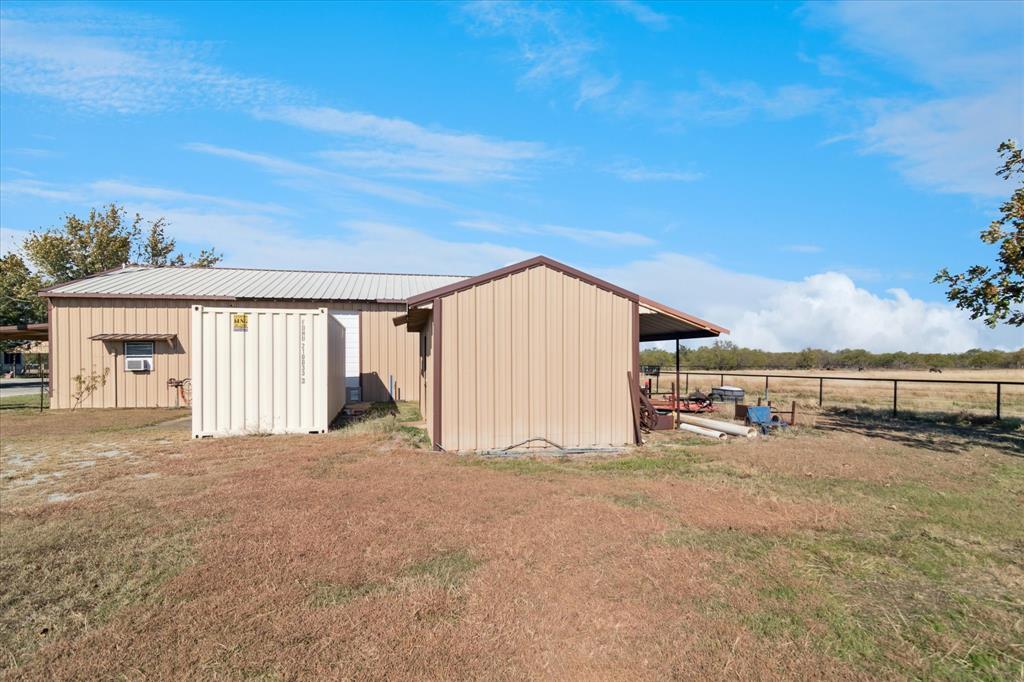 2300 Union Hill Road Sanger, TX 76266 - Photo 29 of 34 a view of a house with a big yard and large trees
