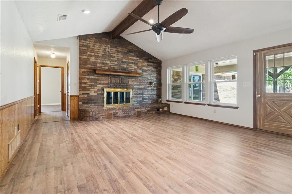 2300 Union Hill Road Sanger, TX 76266 - Photo 7 of 34 an empty room with wooden floor and windows
