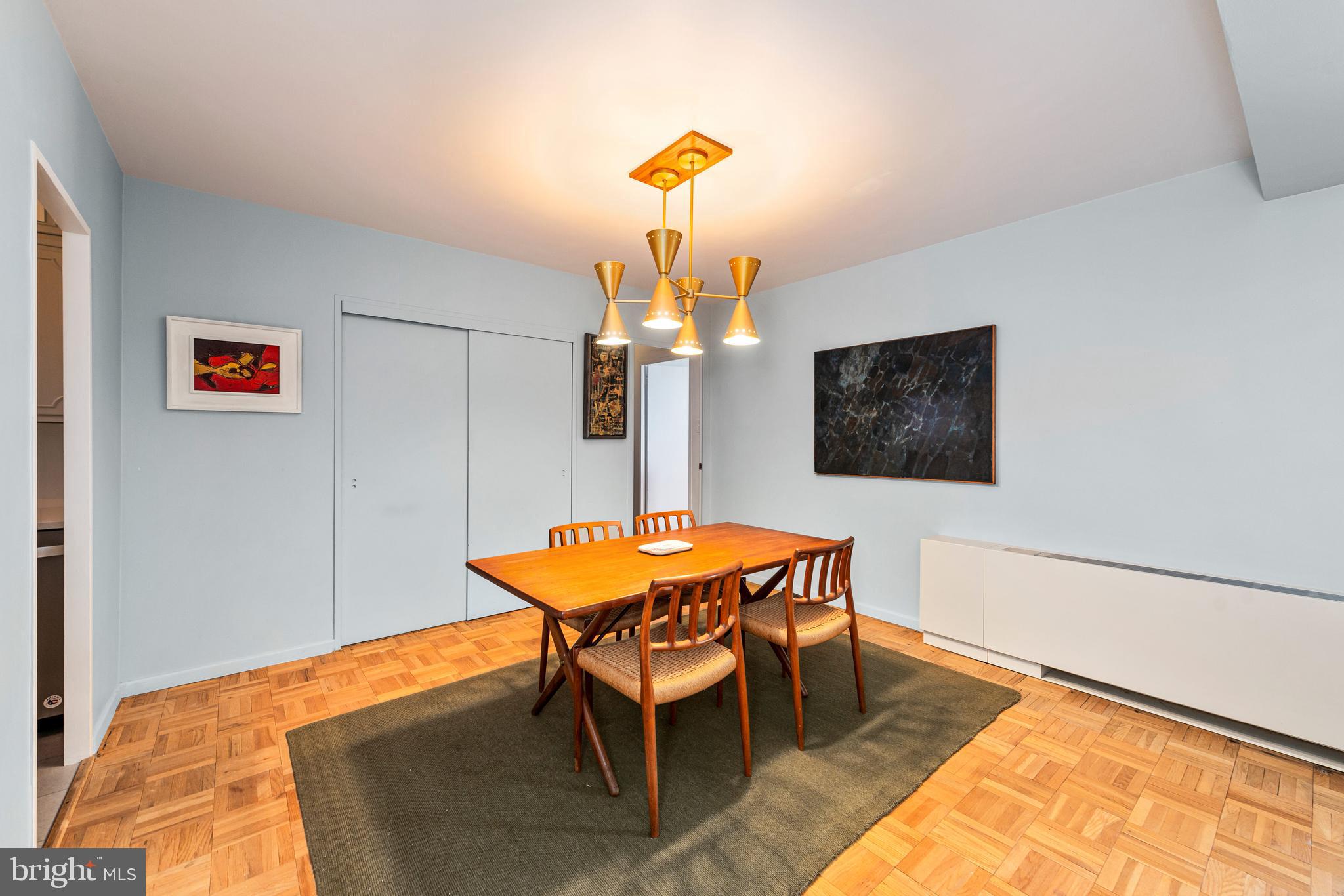 2475 Virginia Avenue Northwest, Unit 700 Washington, DC 20037 - Photo 13 of 36 a dining room with a table and chairs