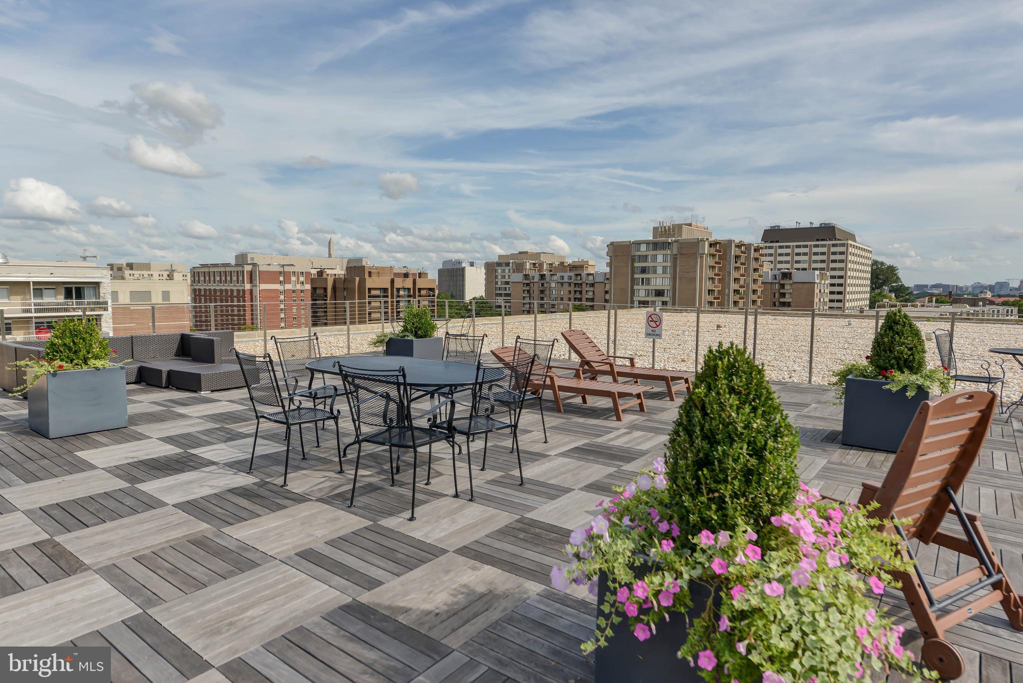 2475 Virginia Avenue Northwest, Unit 700 Washington, DC 20037 - Photo 25 of 36 a view of a terrace with furniture and garden