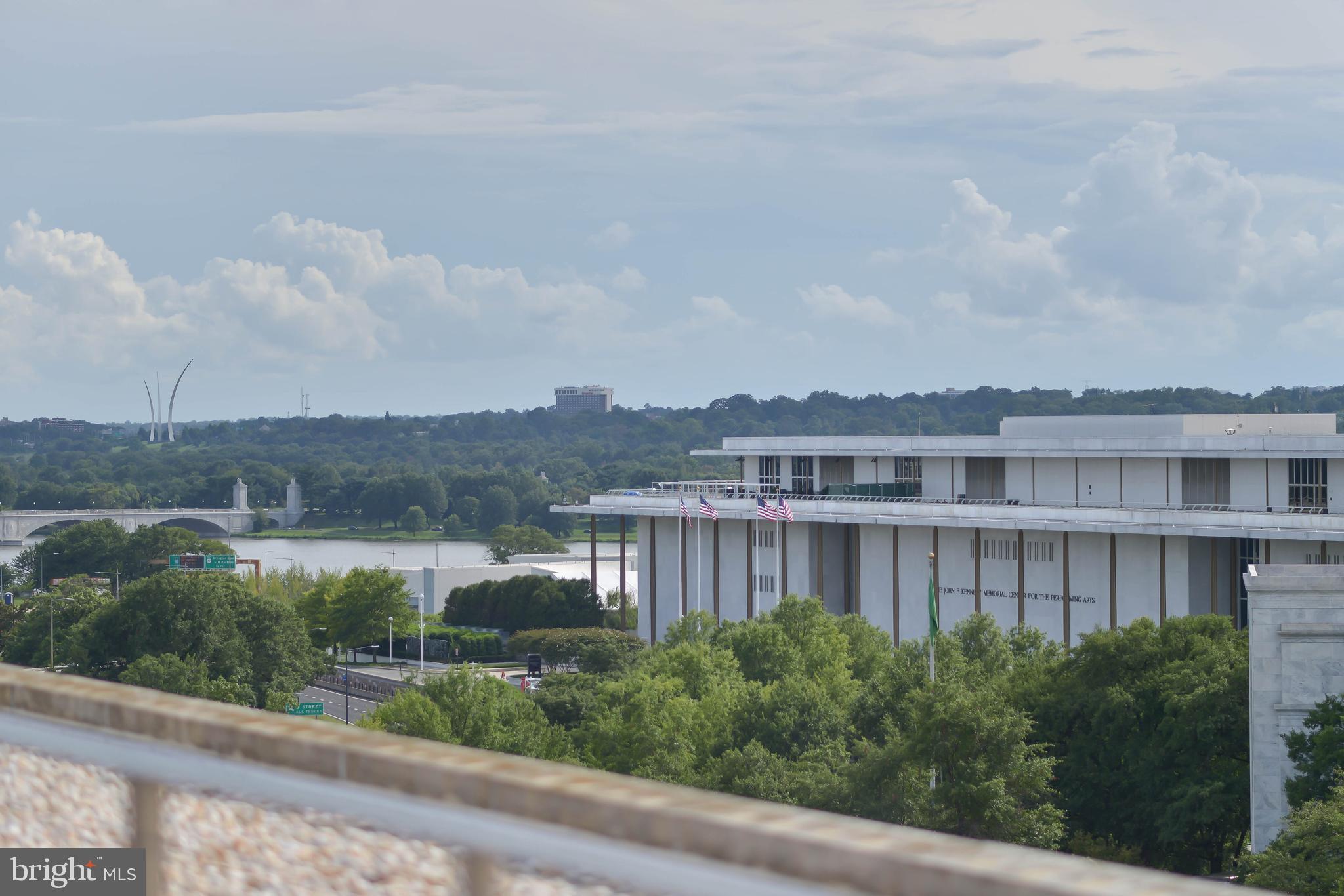 2475 Virginia Avenue Northwest, Unit 700 Washington, DC 20037 - Photo 26 of 36 a view of a lake with a large building in the background