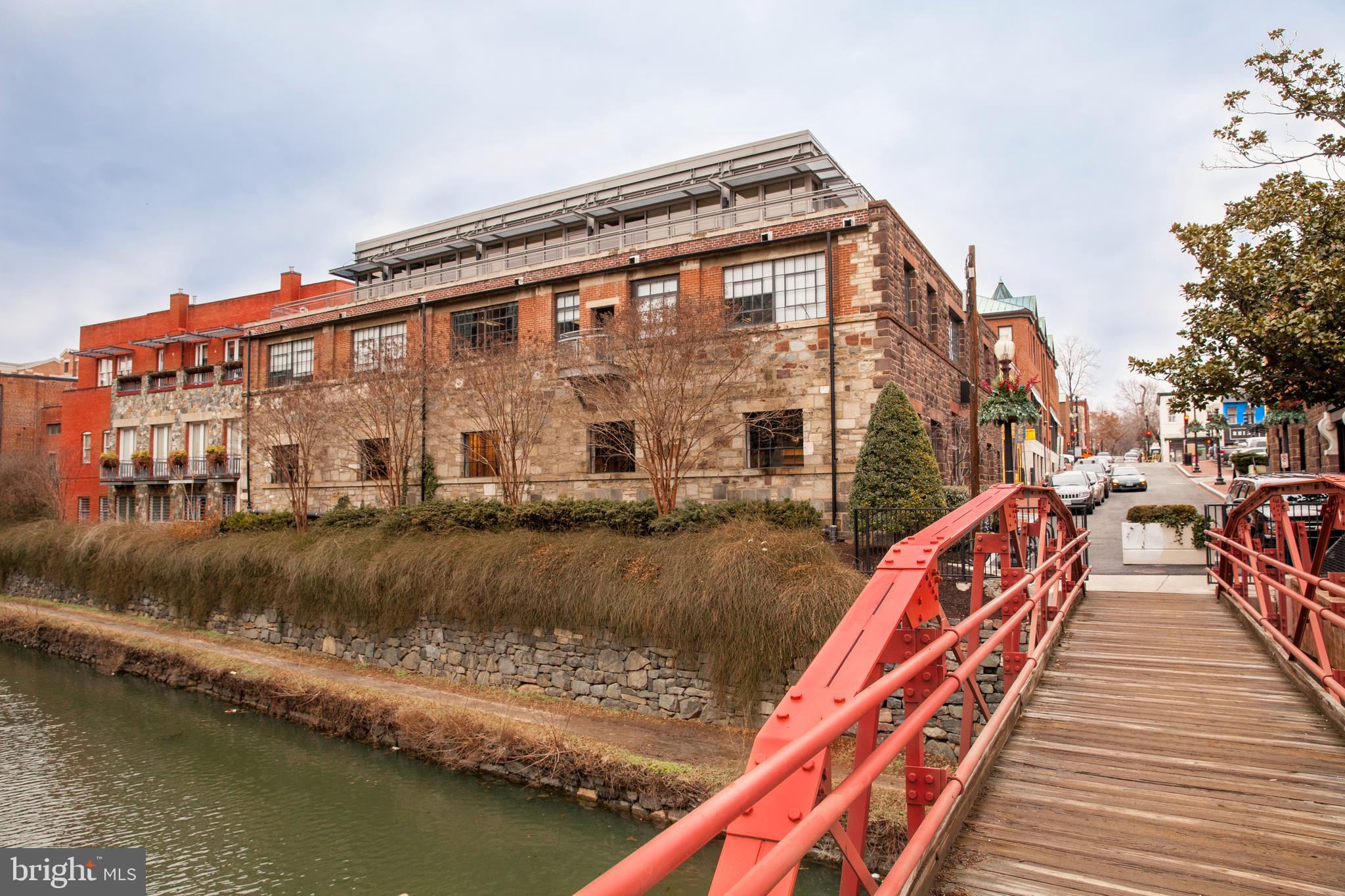 2475 Virginia Avenue Northwest, Unit 700 Washington, DC 20037 - Photo 34 of 36 a large body of water next to a building with large trees