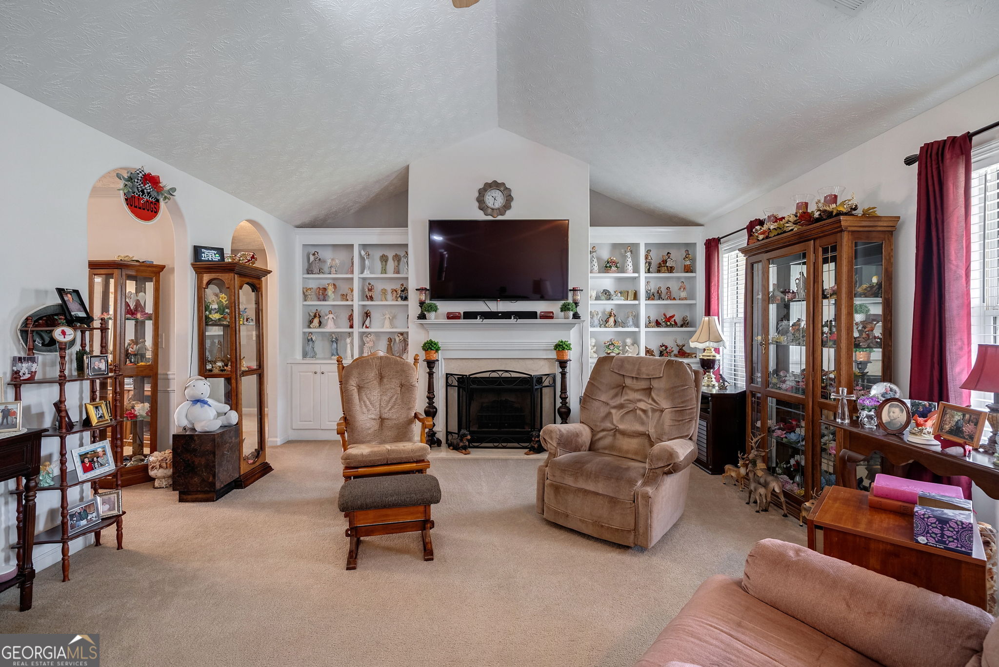 1415 Blanding Way Winder, GA 30680 - Photo 2 of 39 a living room with furniture flat screen tv and a fireplace