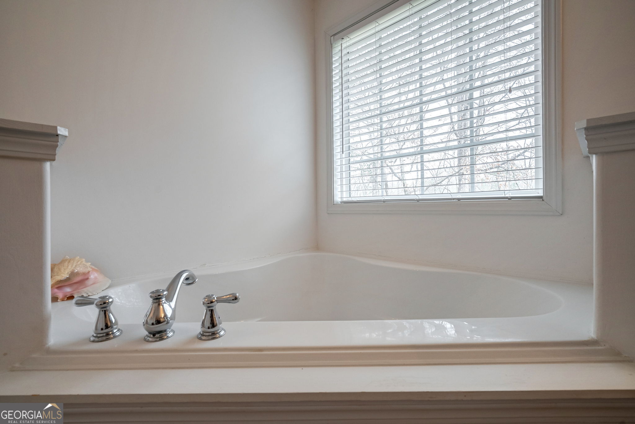 1415 Blanding Way Winder, GA 30680 - Photo 23 of 39 a bathroom with bathtub and window