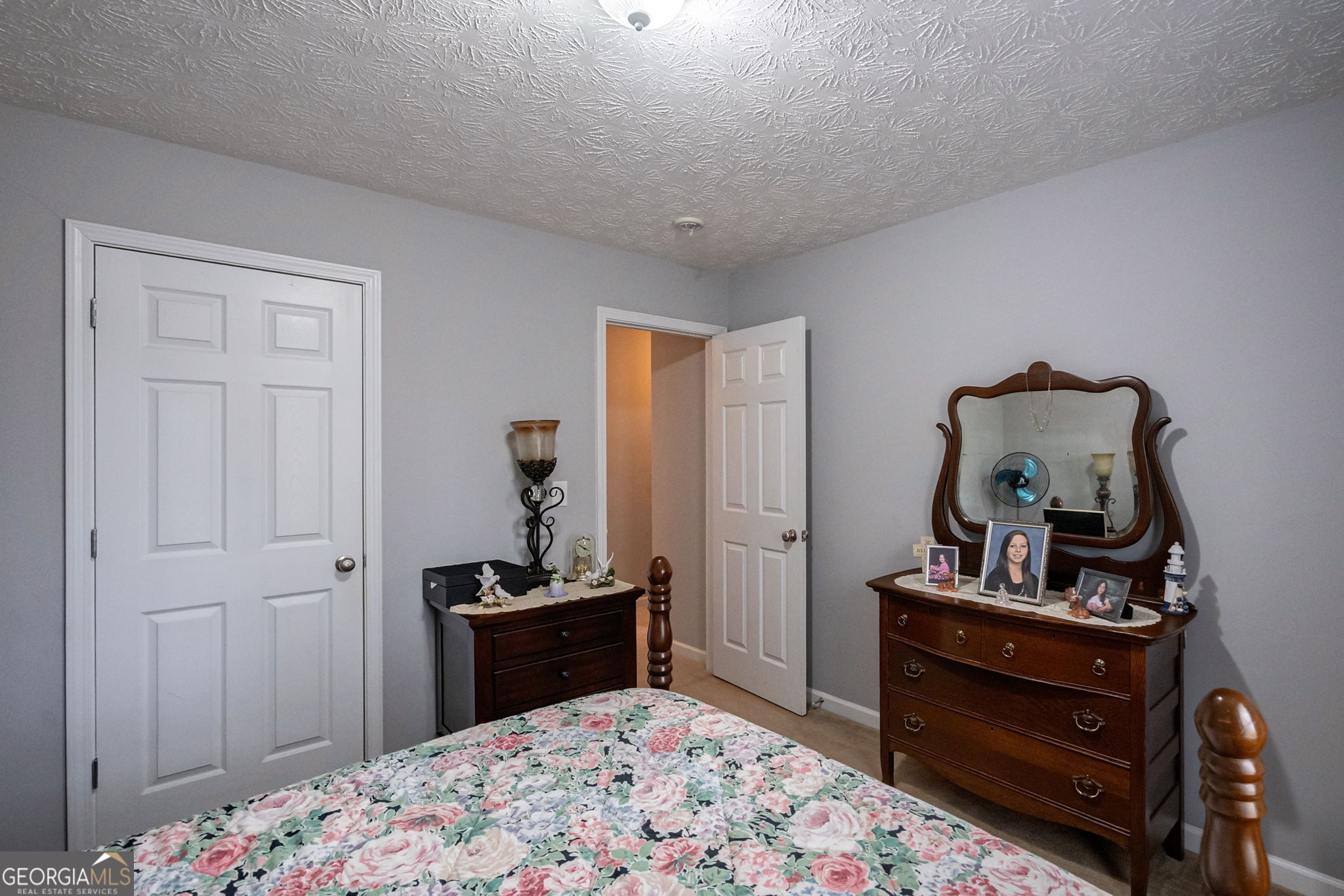 1415 Blanding Way Winder, GA 30680 - Photo 30 of 39 a bedroom with a bed and a dresser in it